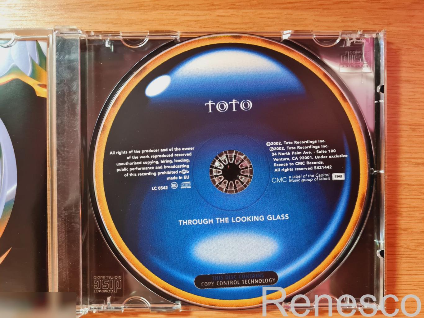 Toto ?– Through The Looking Glass (Europe) (2002) 4