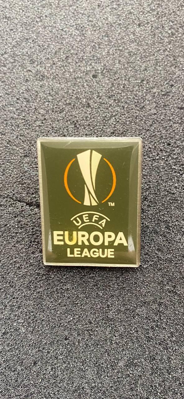 …-.. . . Лига Европы. Официальный знак --.-.