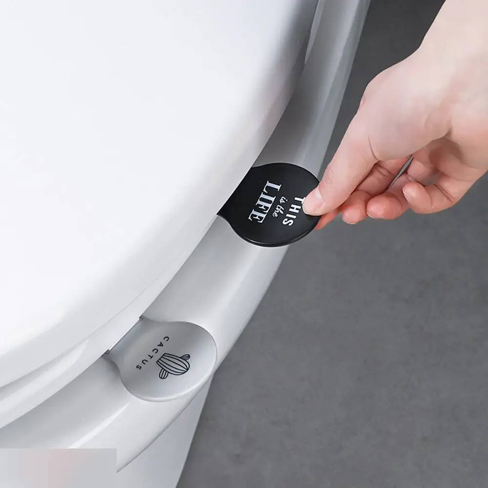 Приспособление для поднятия сиденья унитаза серое