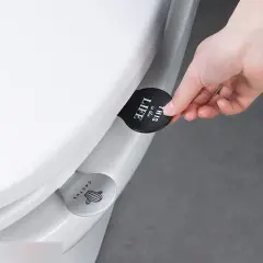 Приспособление для поднятия сиденья унитаза серое