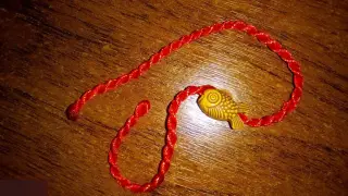 Браслет красная нить рыба