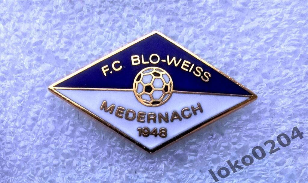 Знак - FC BLO - WAISS Medernach - Люксембург.