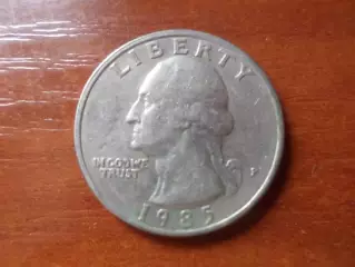 Монета 25 центов США квотер 1985 г